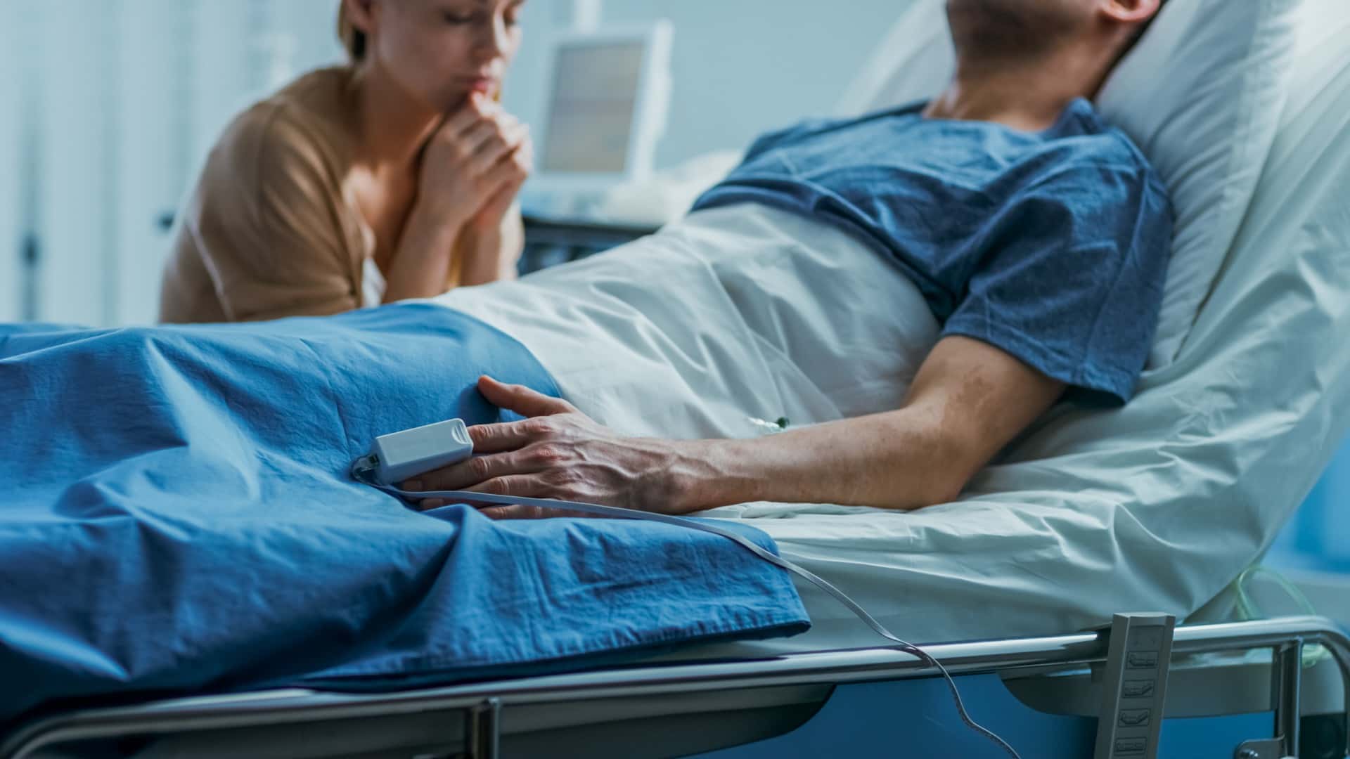 Man Lying on the Hospital Bed With Problematic Wife | Long Term Care Planning​​ | Legacy Law Group