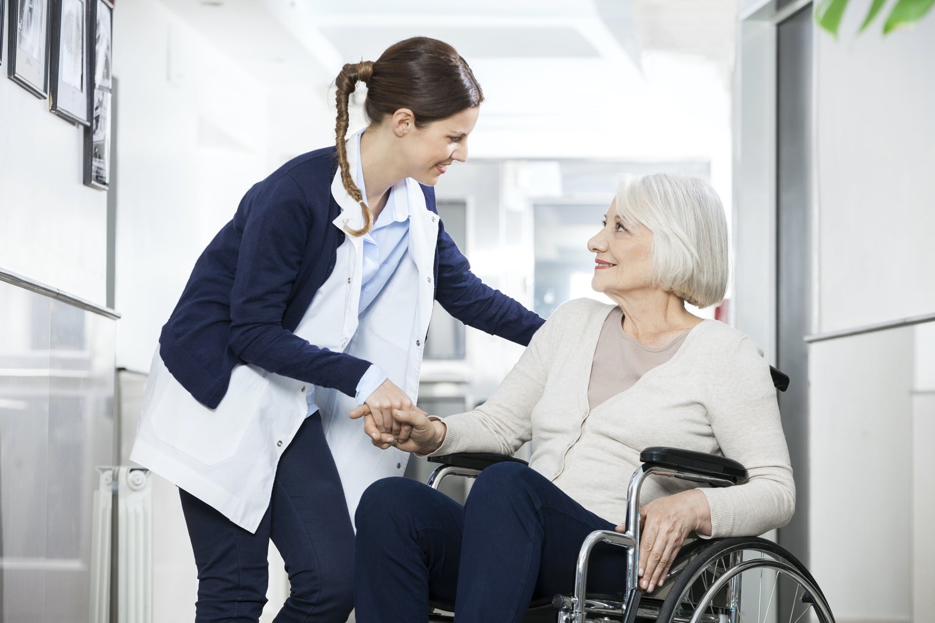 Woman Consoling Senior Woman Sitting In Wheelchair | Elder Law Lawyer​​​ | Legacy Law Group