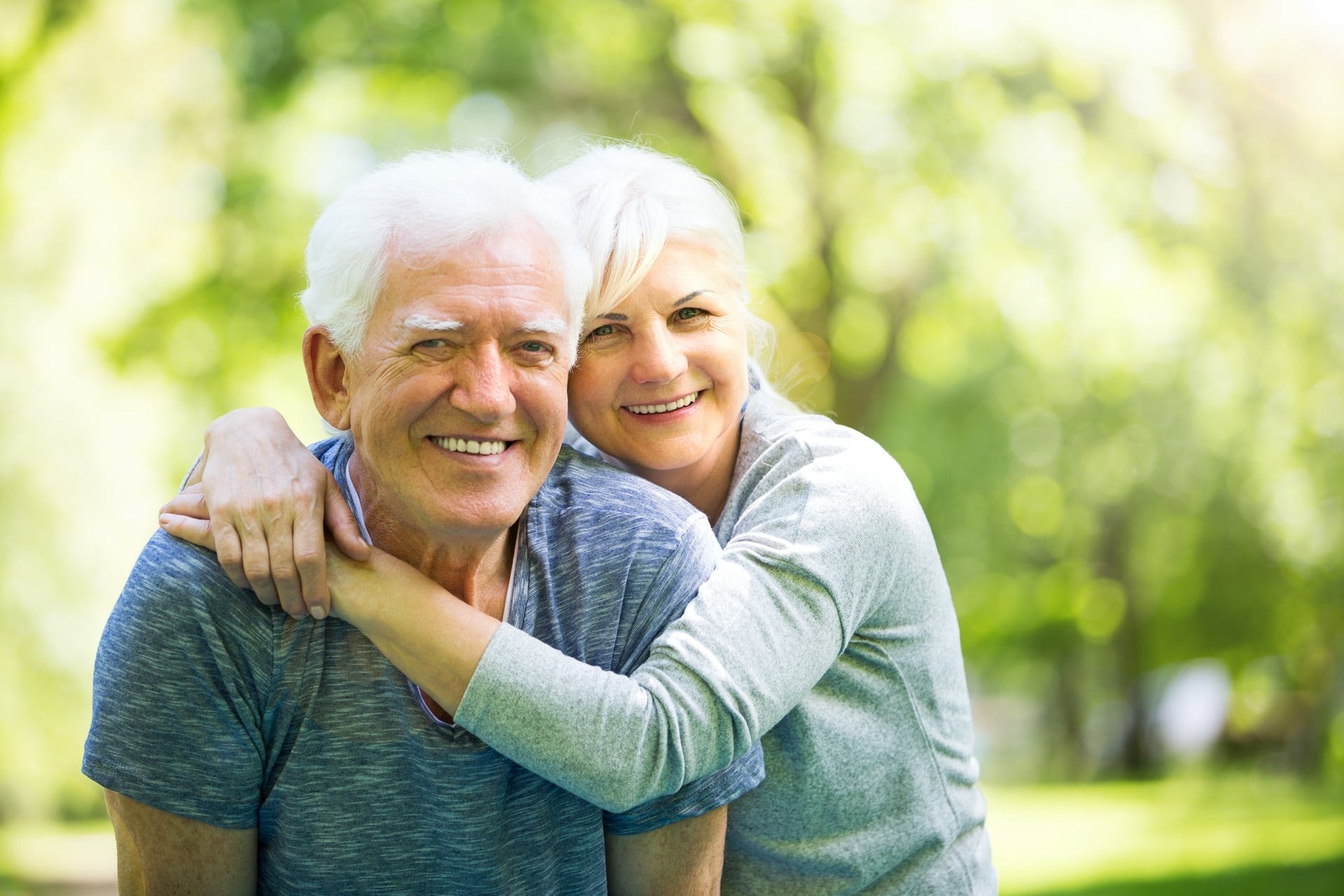 Senior Couple Posing Happily in the Park | Elder Law Lawyer in Washington​​​ | Legacy Law Group
