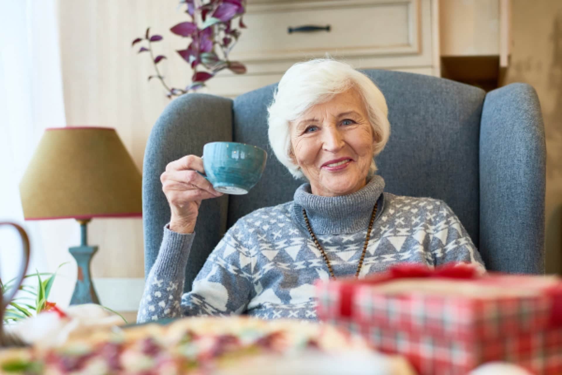 Happy Elderly Woman Drinking Tea l Elder Law Lawyer in Washington​​​ | Legacy Law Group