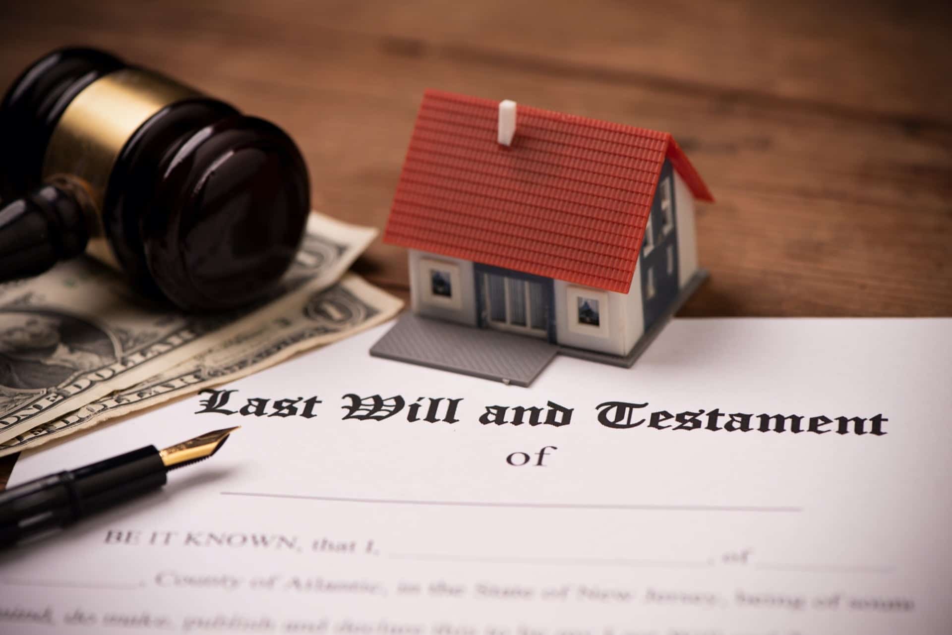 House Toy With Last Will and Testament Document | Living Will vs Living Trust​ | Legacy Law Group