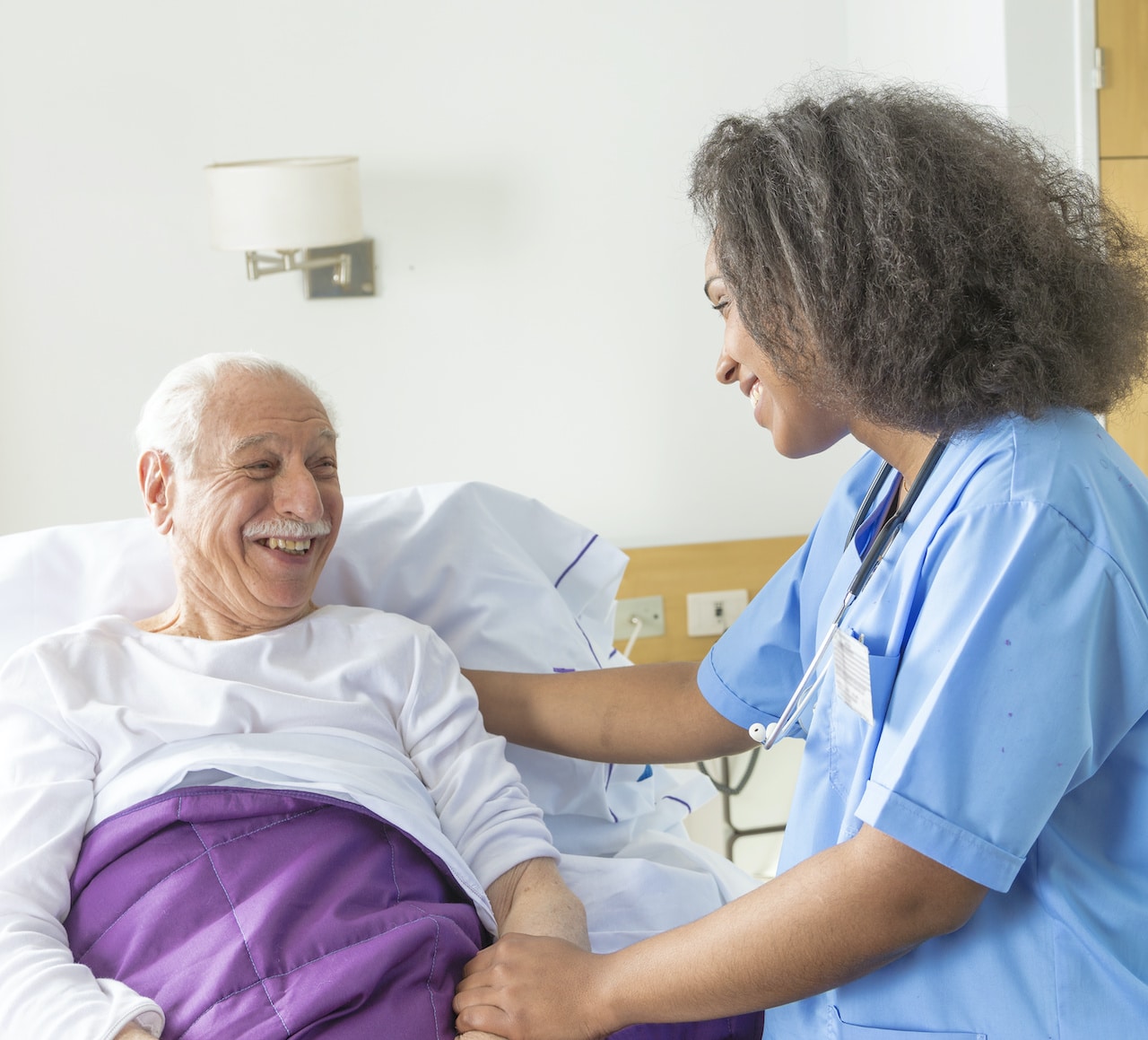 Friendly Nurse Takes Care of Elderly Man | Long Term Care Planning​​ in WA | Legacy Law Group