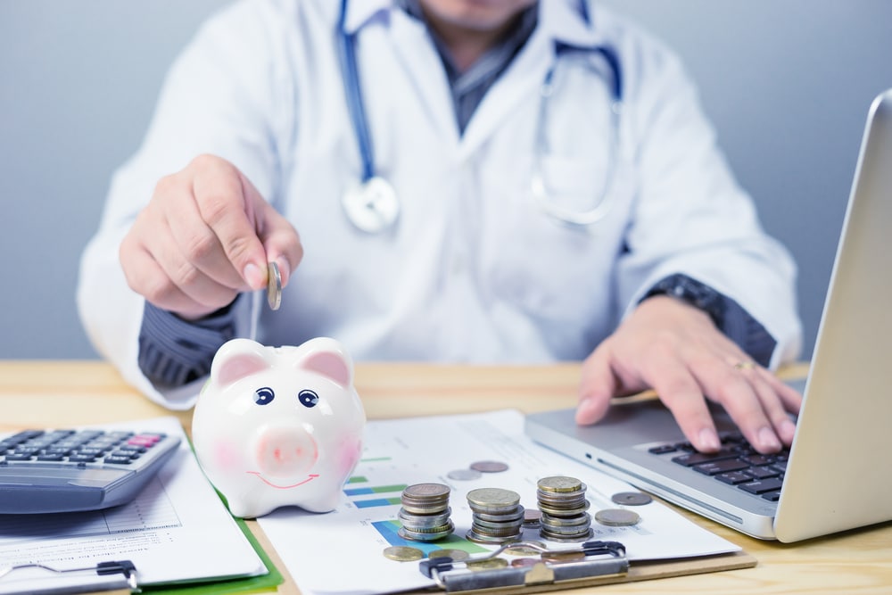 Doctor Holding Out Piggy Ban For Your Savings | Medicaid Planning in Washington​ | Legacy Law Group