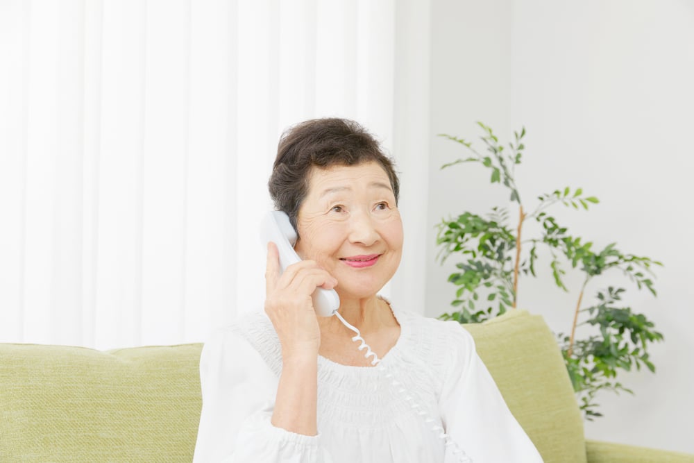 Elderly Woman Talking With A Phone Scammer | Elder Law Lawyer​​​ in Washington | Legacy Law Group