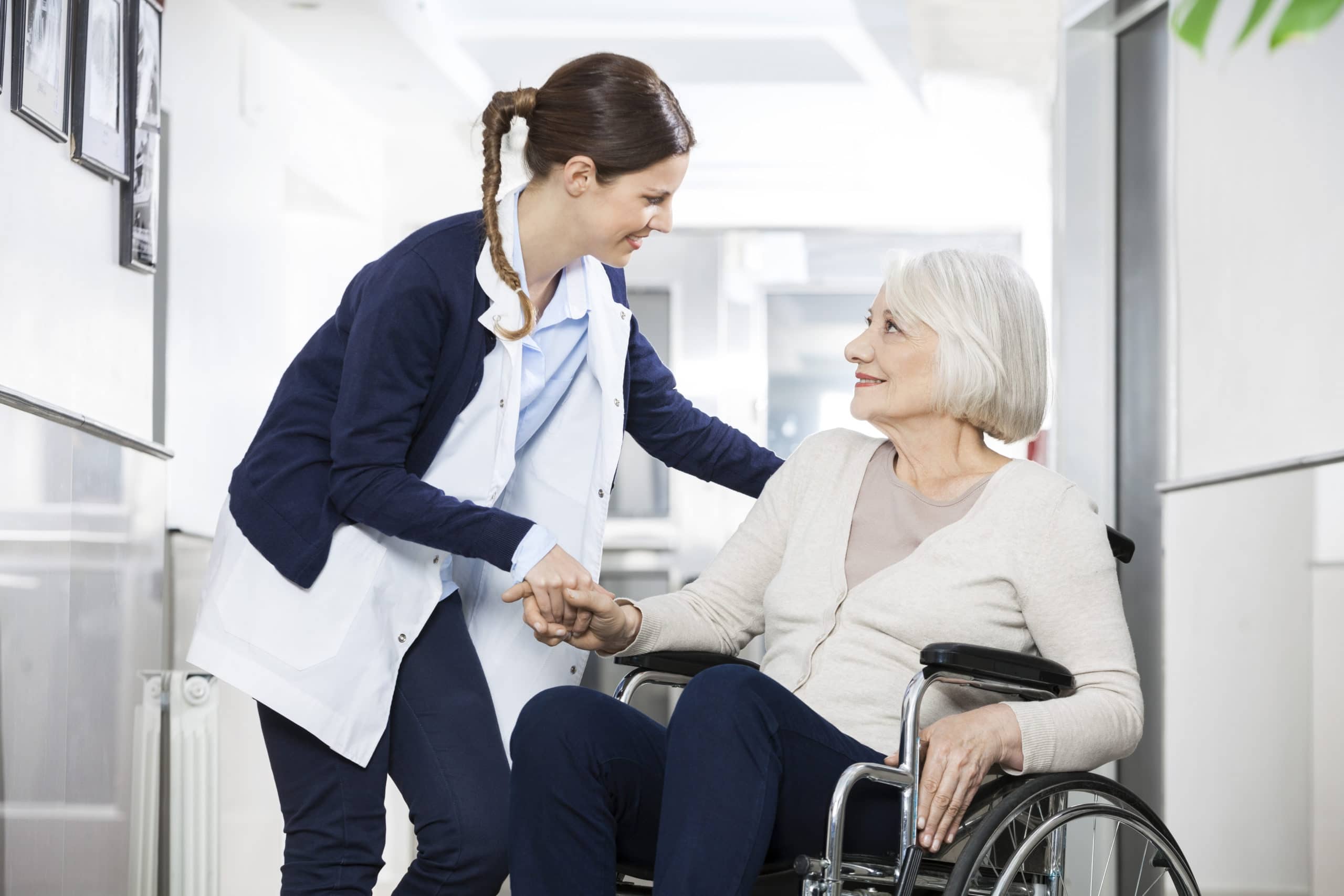 Nurse Helps Senior Woman on Wheelchair | Long Term Care Planning​​ in Washington | Legacy Law Group