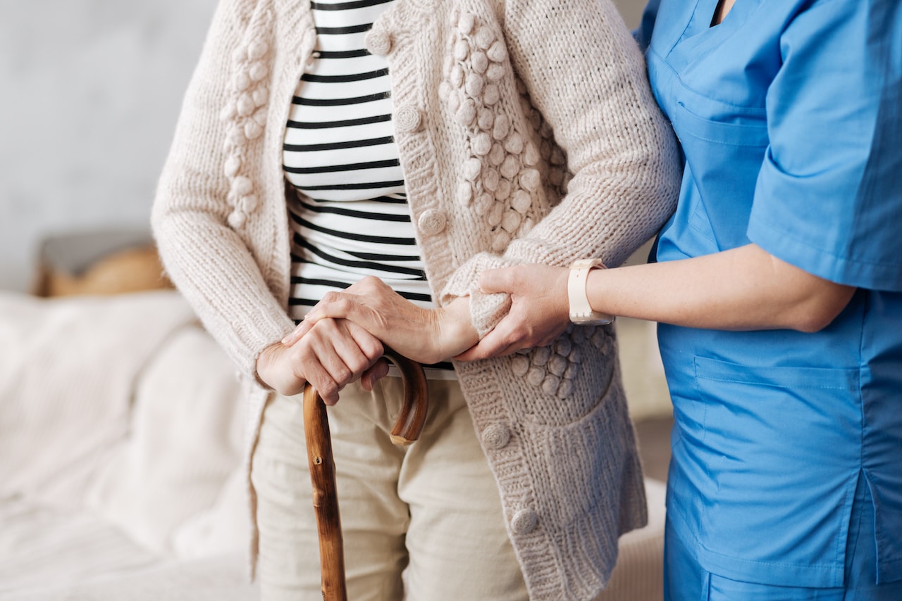 Gentle Nurse Helping Senior Patient | Long Term Care Planning​​ in Washington | Legacy Law Group