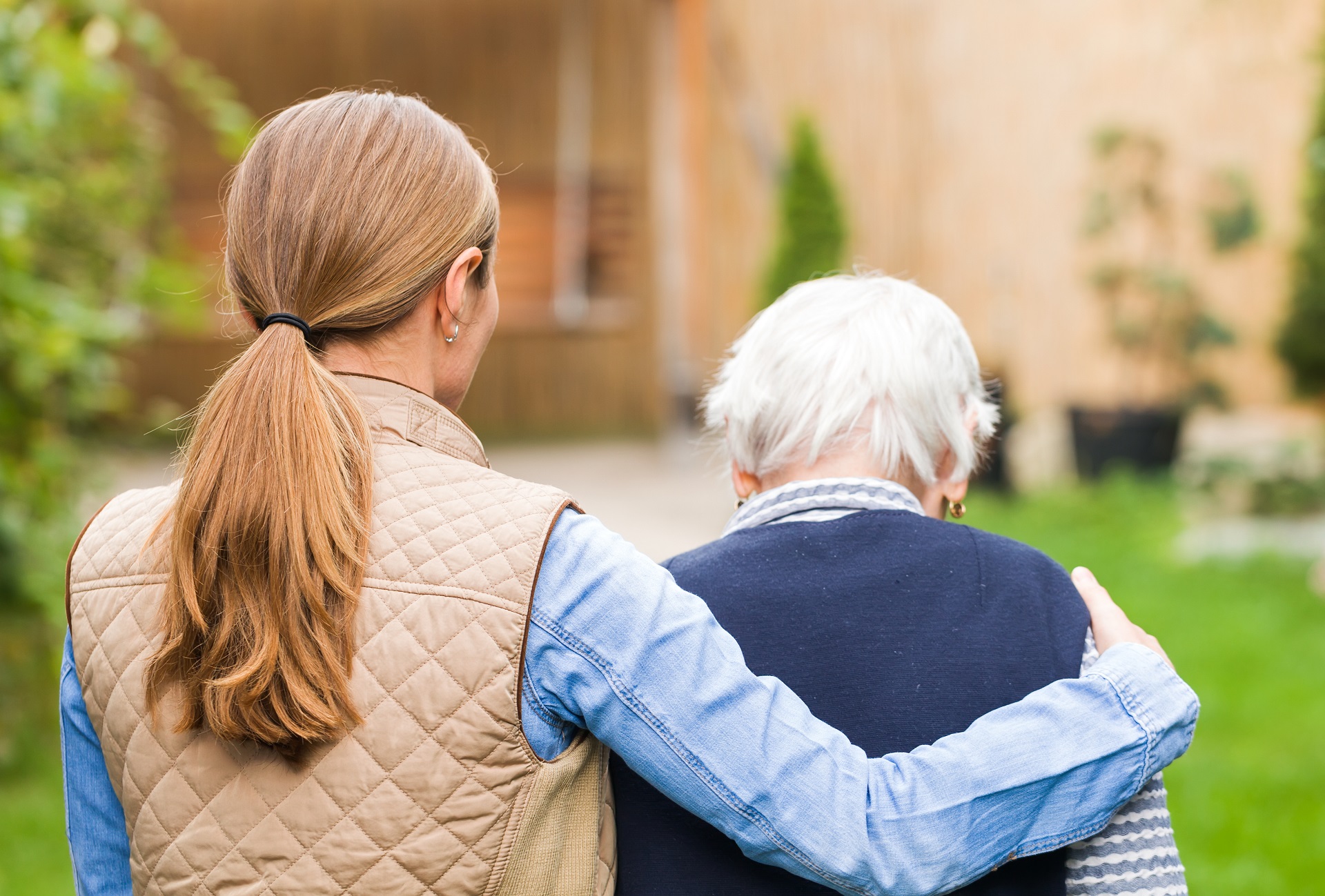 Young Woman Supporting an Elderly Man | Estate Planning Law Firm in Washington​ | Legacy Law Group