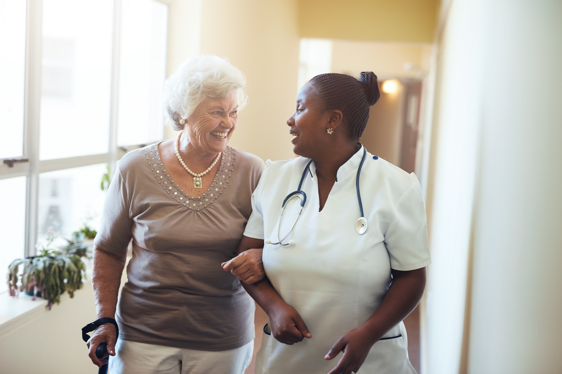 Female Caregiver Talking with Senior Woman | Medicaid Planning in Washington | Legacy Law Group