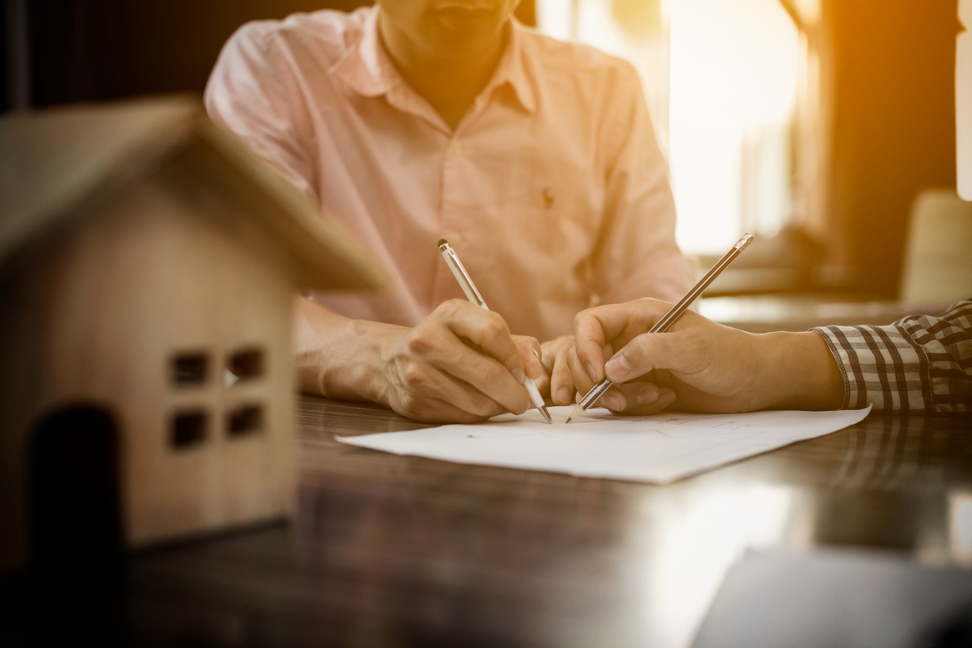 Client Signs For Home Contract Property for Sale | Estate Planning Law Firm​ | Legacy Law Group