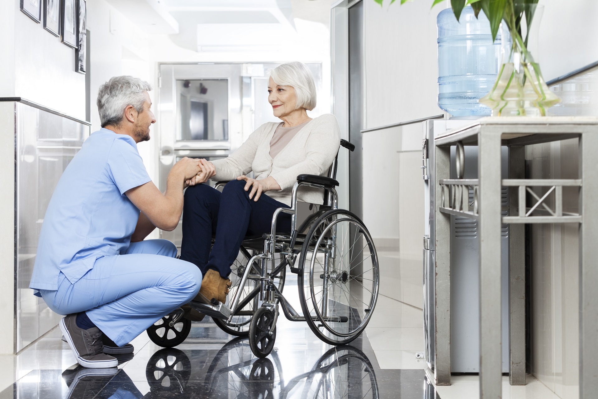 Male Nurse Taking Care of Senior Woman | Long Term Care Planning​​ in Washington | Legacy Law Group