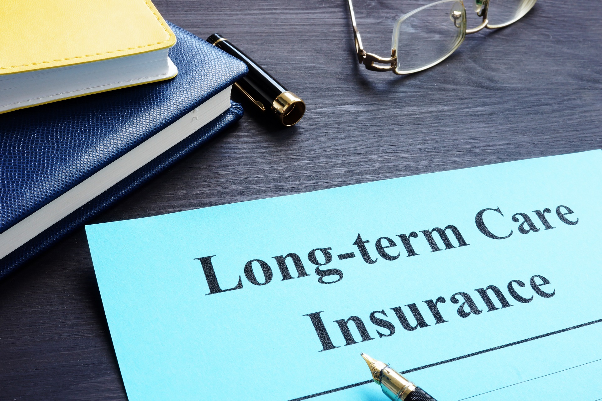 Long Term Care Insurance Text on Folder | Advance Care Planning​ in Washington | Legacy Law Group