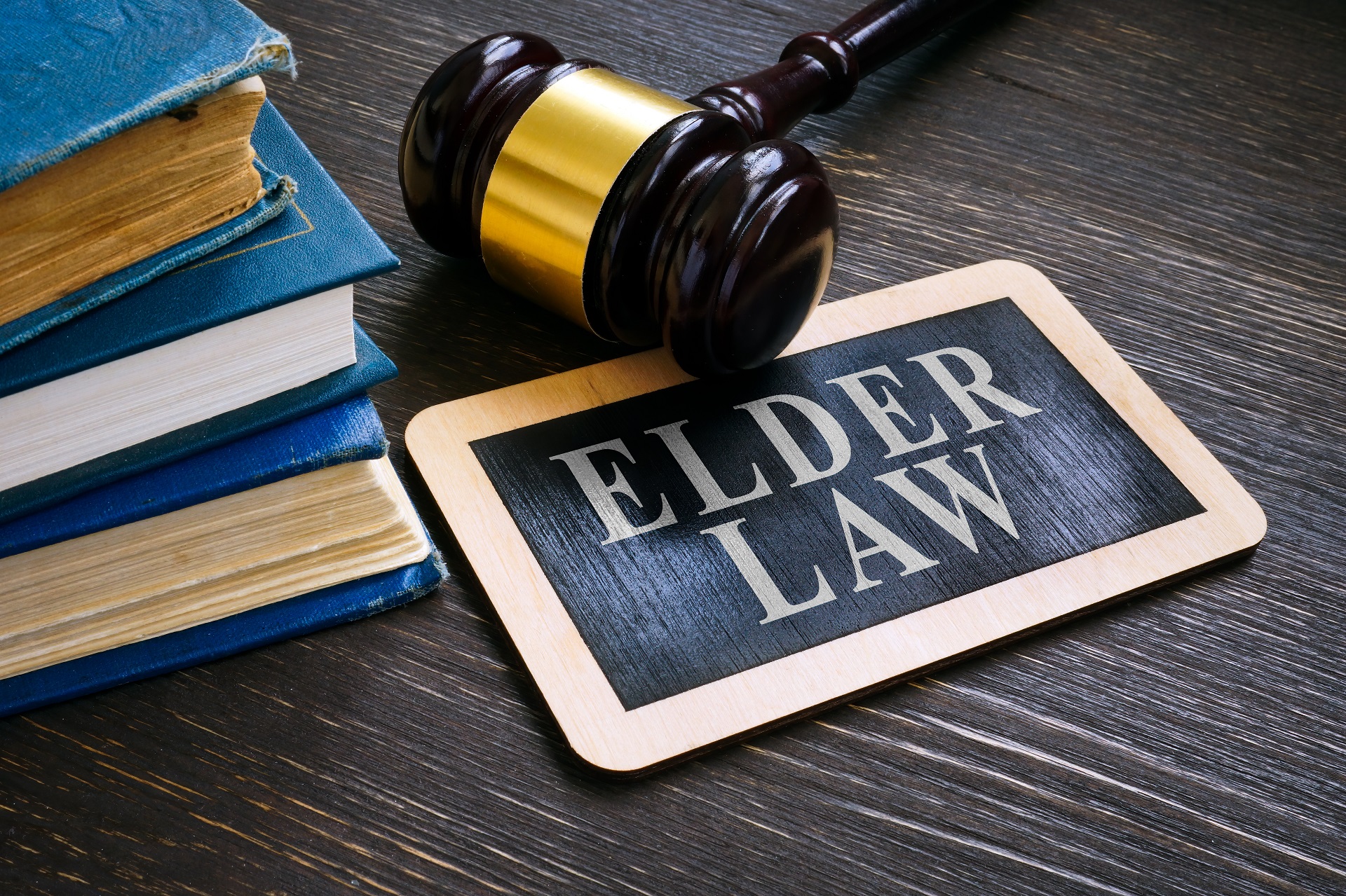 Gavel with Elder Law Plate and Books | Family Estate Planning in Washington​​ | Legacy Law Group
