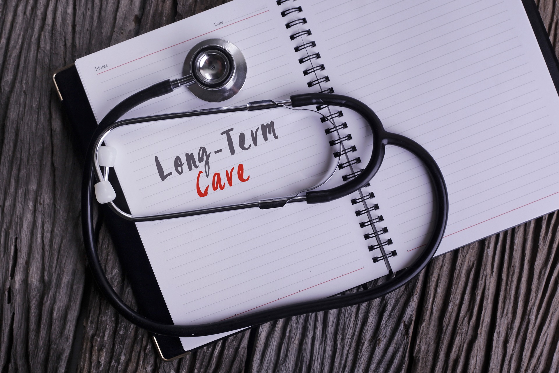 Long Term Care Wording on a Notebook | Estate Planning and Elderly Law Firm​ | Legacy Law Group