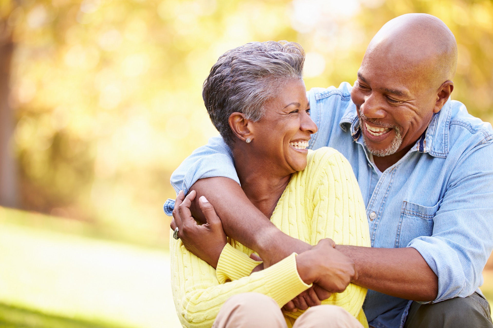 Senior Couple Hugging and Smiling | Family Estate Law | Long Term Care Planning​​ | Legacy Law Group