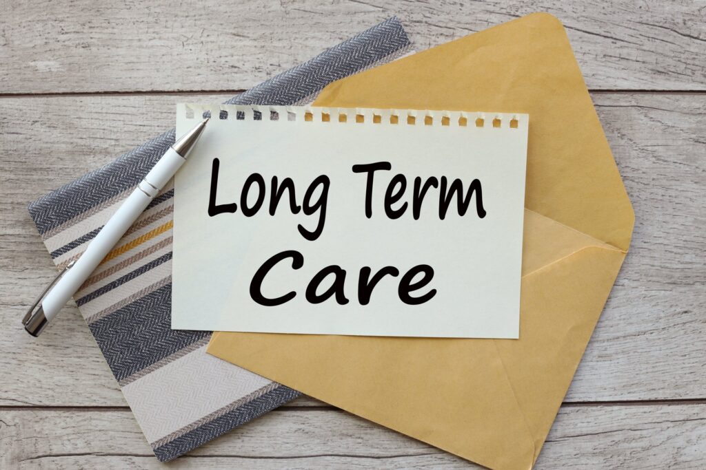 sheet of paper on an envelope on a notepad text says long term care