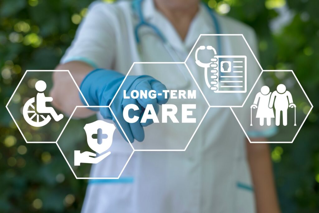 Person with a stethoscope around their neck wearing a blue glove poiting at long-term care